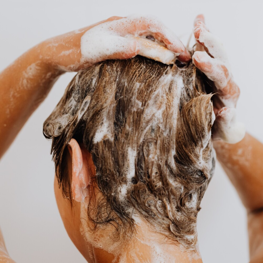 Why we should shower and wash our hair less often